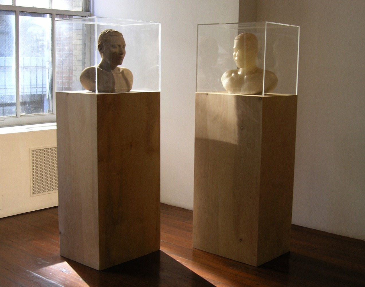 Untitled, 2004
Cast from self, sand, fiberglass, evaporating compound, acrylic and wood
18" x 24" x 20"