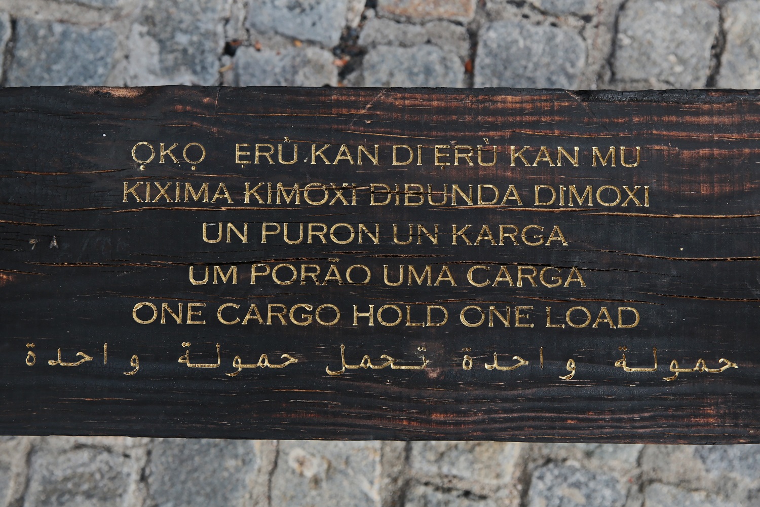 Grada Kilomba
Untitled Poem (one cargo hold, one load), 2022
Charcoal log with gold leaf engraving
30 x 30 x 90 cm / 11.8 x 11.8 x 35.4 in.
Enquire
