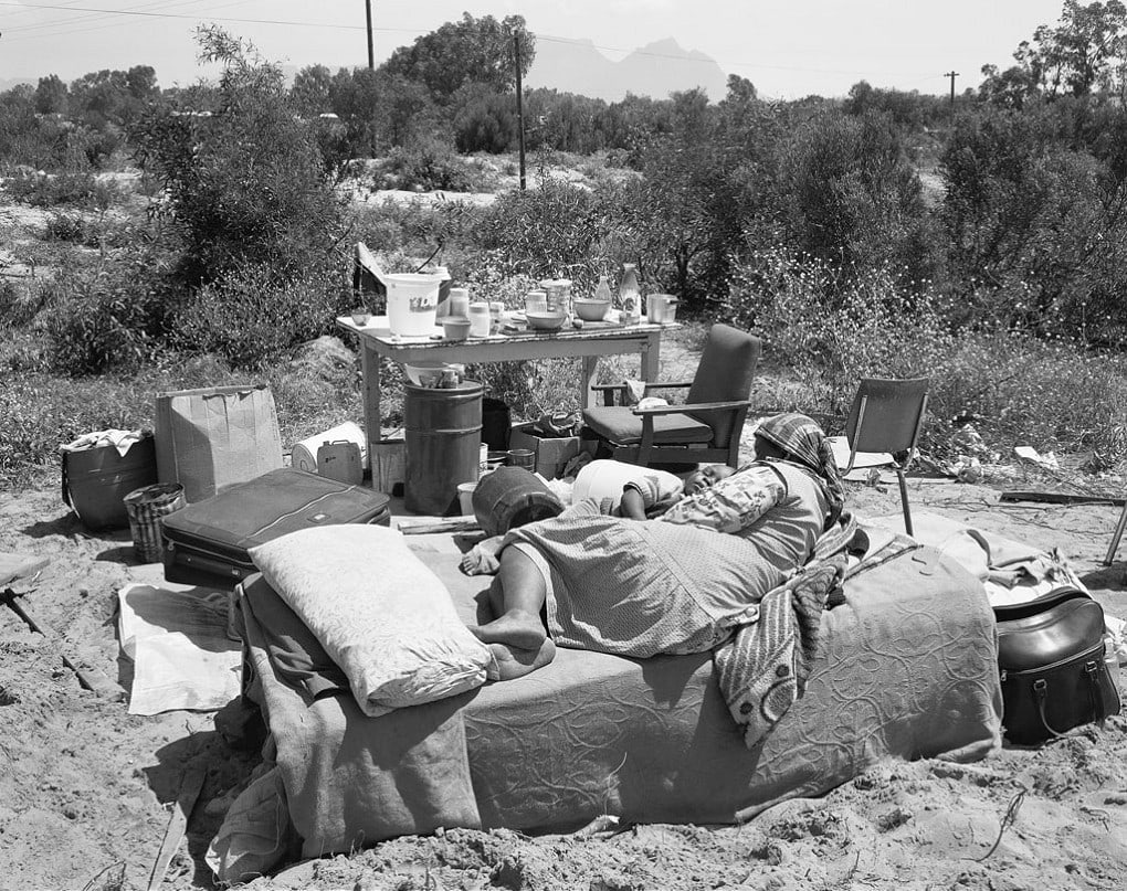 David Goldblatt Mother and child in their home after the destruction of its shelter by officials of the Western Cape Development Board Crossroads, Cape Town, 11 October 1984. (4_3614), 1984 Silver gelatin print on fibre-based paper Work: 48.5 x 59.5 cm (19.1 x 23.4 in.) STD 1/10