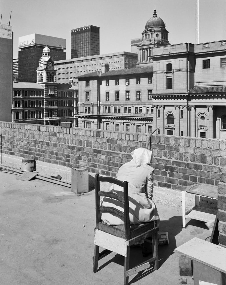 David Goldblatt
Rooftop Servants&amp;rsquo; quarters Alpheun house, with City Hall and GPO Rissik Street, Johannesburg. 7 August 1984 (4_3564), 1984
Silver gelatin hand print
Work: 35 x 28 cm / 13.8 x 11 in.
Frame: 57.2 x 49.8 cm / 22.5 x 19.5 in.

Enquire