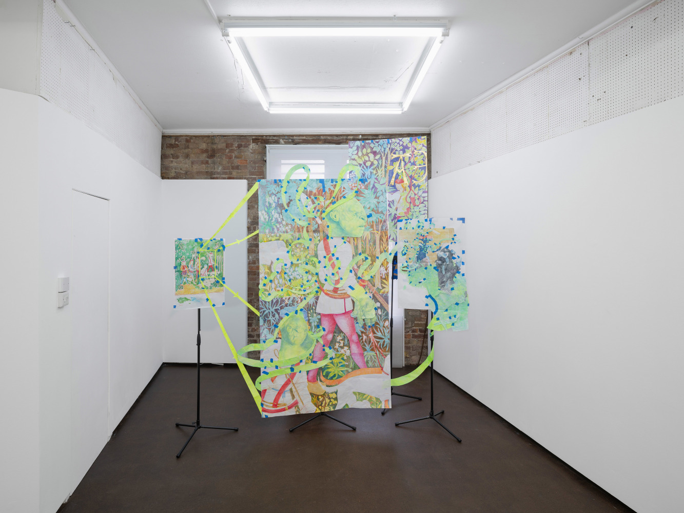 Sam Keogh, Pages from The Hunters Enter the Woods Cartoon, 2024, acrylic, watercolour, coloured pencil and gold leaf on 70gsm acid-free layout paper, masking tape, gaffer tape, cardboard cutouts, mic stands. Dimension variable. Photo: Ollie Harrop