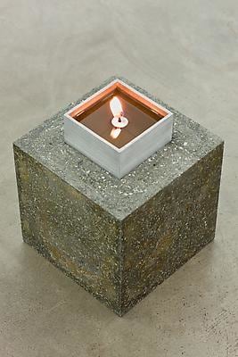 Siobh&amp;aacute;n Hapaska,&amp;nbsp;Footings, 2011, jesmonite, iron powder, white granulated marble, slate powder, perlite,vermiculite, olive oil and lit taper, 25 elements arranged in a specified grid, 19 x 15 x 15 cm each / 7.5 x 5.9 x 5.9 in each