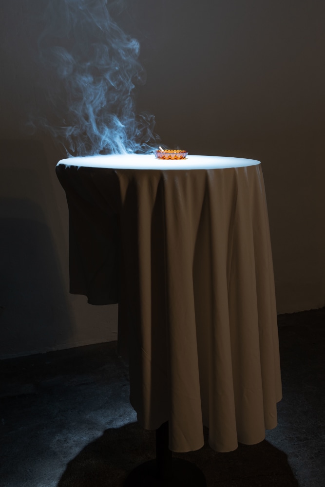 Andy Fitz&amp;nbsp;

Smoking Table, 2023

cigarette, ashtray, table, tablecloth, extended steel base, small smoke machine, timer

154 x 65 x 65 cm