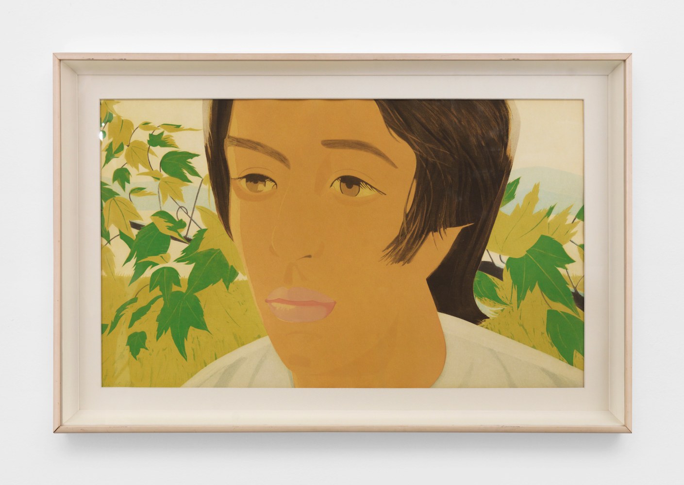 An earth toned Alex Katz aquatint of a boy with dark brown hair looking to the left surrounded by leaves with faint mountains in the back