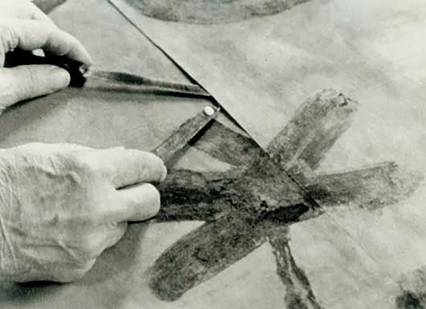 8.&amp;nbsp;The handmade Japanese goyu paper that Glankoff uses is slightly larger than the 19&amp;Prime;x 24&amp;Prime; Masonite matrix boards. Although not pictured here...when the flattened paper panels are removed from the press, Glankoff removes the white margin edges from either two or three sides of the panel. This is a close up of Glankoff joining the flattened panels together with glue, on his drafting table.&amp;nbsp;Sam Glankoff mastered this unique transfer painting process; utilizing multiple matrix boards, multiple paper panels, multiple layers of colors, ultimately joining the work together to create a larger &amp;ldquo;whole&amp;rdquo; while sustaining the spontaneity of his brushstroke and gesture of his imagery.