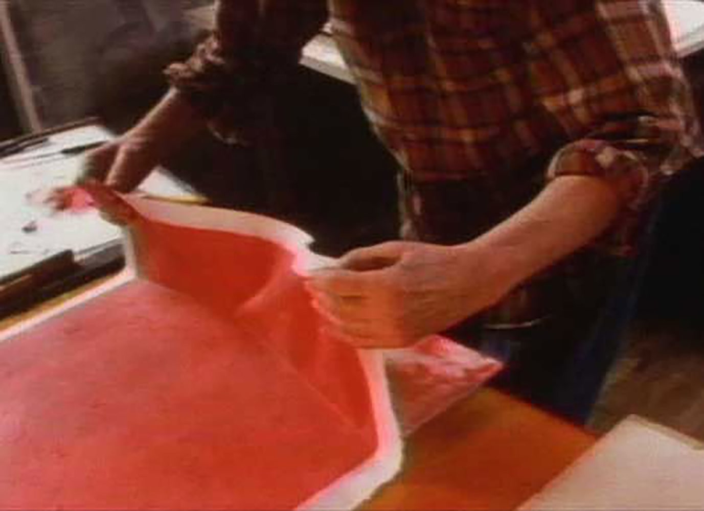 6.&amp;nbsp;Glankoff carefully separates the moistened paper panel, saturated with color, from the matrix board.