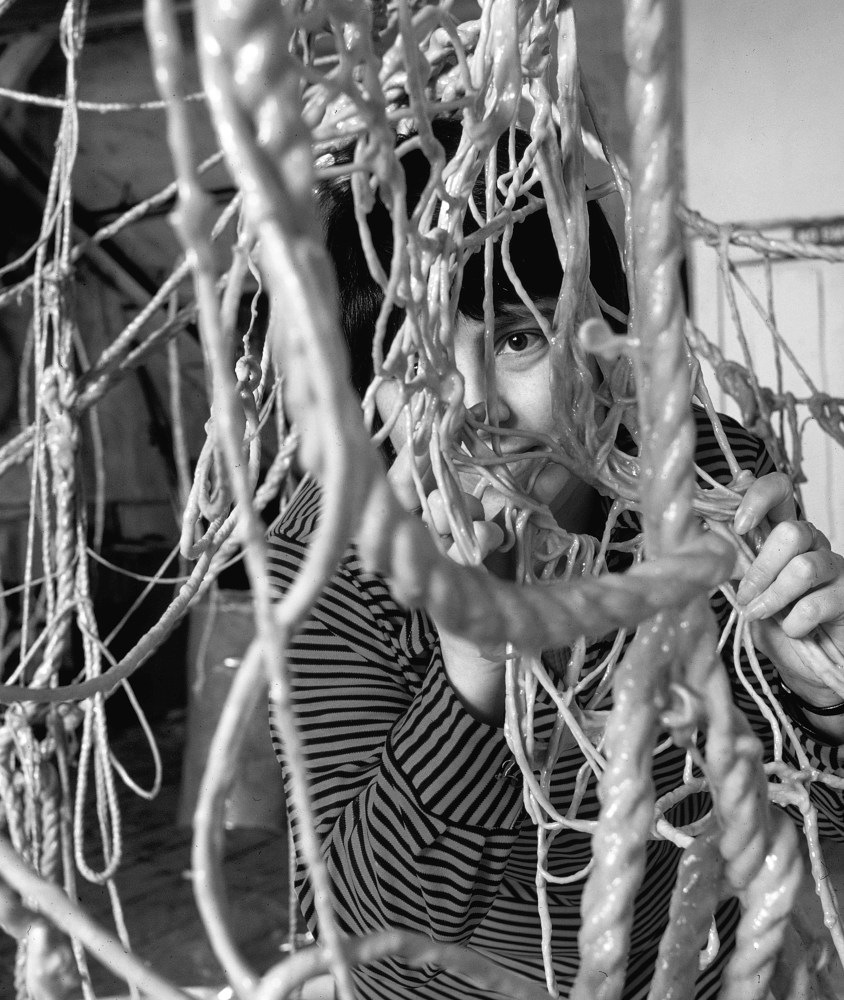 Eva Hesse peering through her sculpture of
rubber-dipped string and rope in 1969,
photo by Henry Groskinsky
Photo: Getty Images / The LIFE Picture Collection.