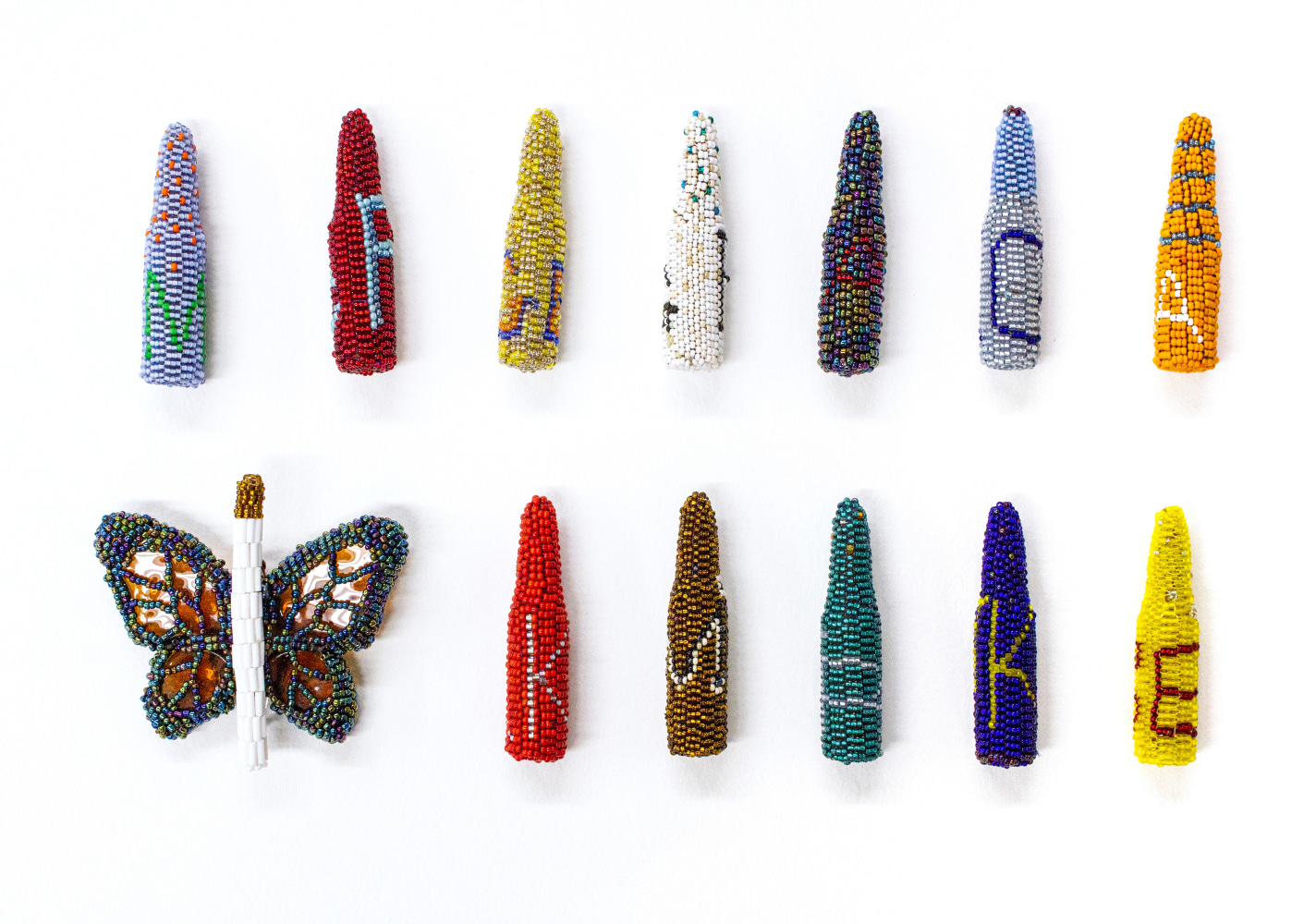 Excessive Froce, 2018
Glass beads, thread, glass, found object
Bullets: 2 7/8 x 3/4 x 3/4 in. (7.3 x 1.9 x 1.9 cm)
Butterfly: 3 1/2 x 3 1/4 x 1 1/4 in. (8.9 x 8.3 x 3.2 cm)
Beaded bullets with the initials of individuals who perished through the use of excessive force. Individuals include: Katheryn Johnson, Tamir Rice, Korryn Gaines, Trayvon Martin, Rodney King, Mike Brown, Philando Castille, Sandra Bland, Erica Garner, Amadou Diallo, Freddie Gray, Tanisha Anderson, Eric Garner's Soul (Butterfly)
Scot-1151-C