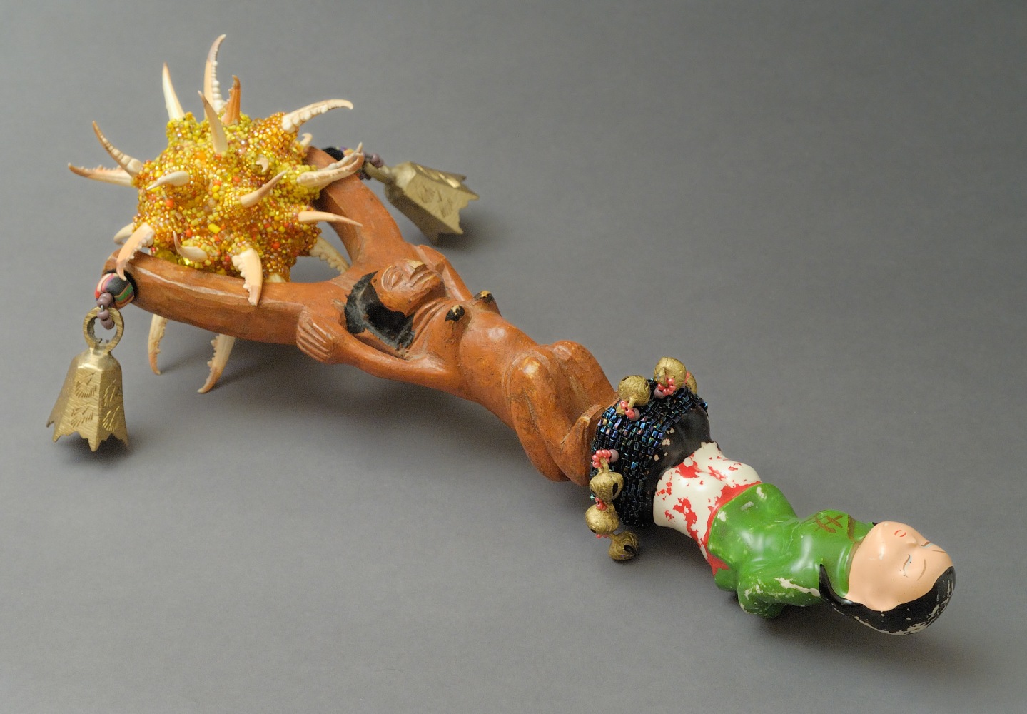 From the Ancestry/ Progeny Series: Race Rattle, 2009&amp;nbsp;
Ceramic crockery, wooden African sling shot, glass beads, crab claws, thread
13 x 7 1/2 x 4 in. (33.02 x 19.05 x 10.16 cm)
SCO-0331-C-OS