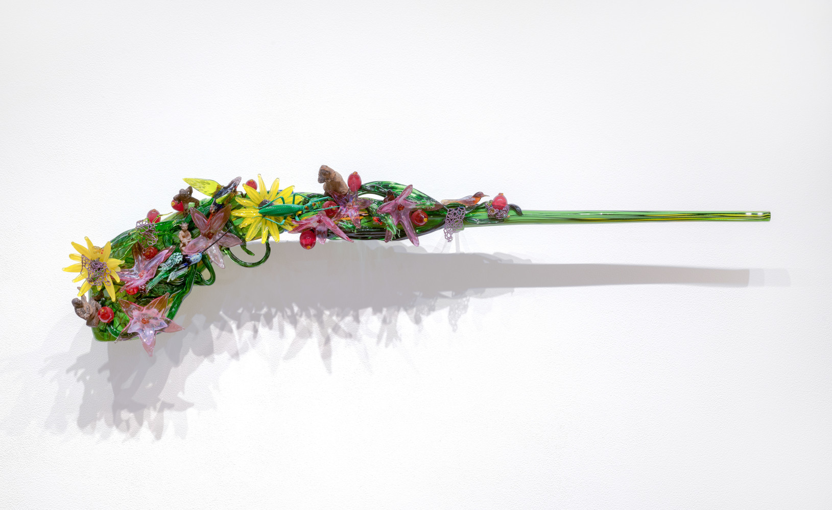 Harriet&amp;#39;s Rifle 2,&amp;nbsp;2018

Blown glass, glass beads, thread, repurposed objects

10 x 45 x 6 in. (25.4 x 114.3 x 15.2 cm)

Scot-1129-C