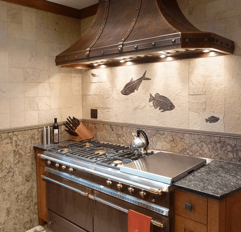 Fossil tile backsplash made from multi-colored limestone tiles.