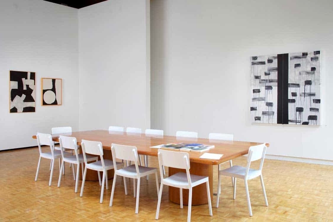 Tony Smith, Untitled, 1962, oil on canvas, 44 x 28 inches, and Untitled, 1959, oil on canvas, 30 x 34 inches, with Torkwase Dyson, Orientation #2, 2018, acrylic, string, and steel on canvas, 5 x 5 feet, in Scaler, Suzanne Lemberg Usdan Gallery, Bennington College, Bennington, Vermont, September 18&amp;ndash;December 15, 2018.