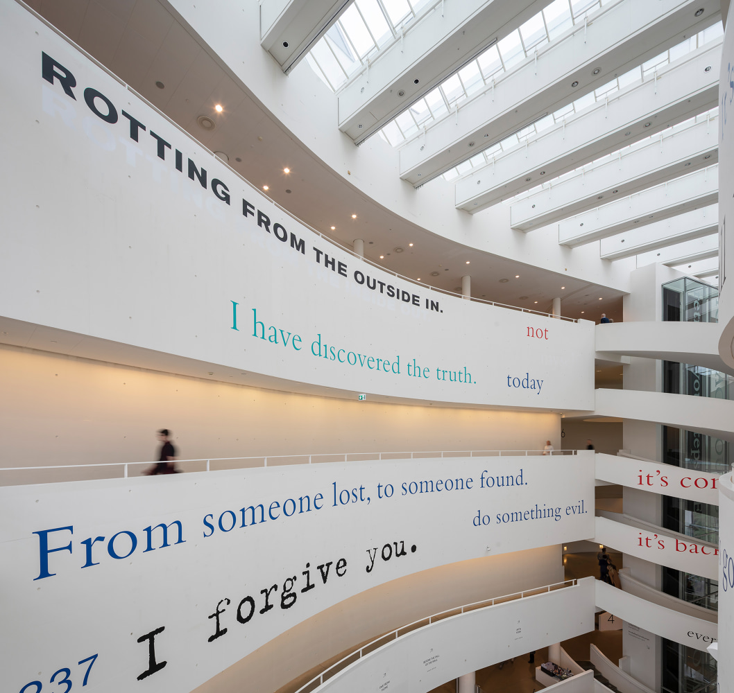 Installation view of wall quotes by Douglas Gordon