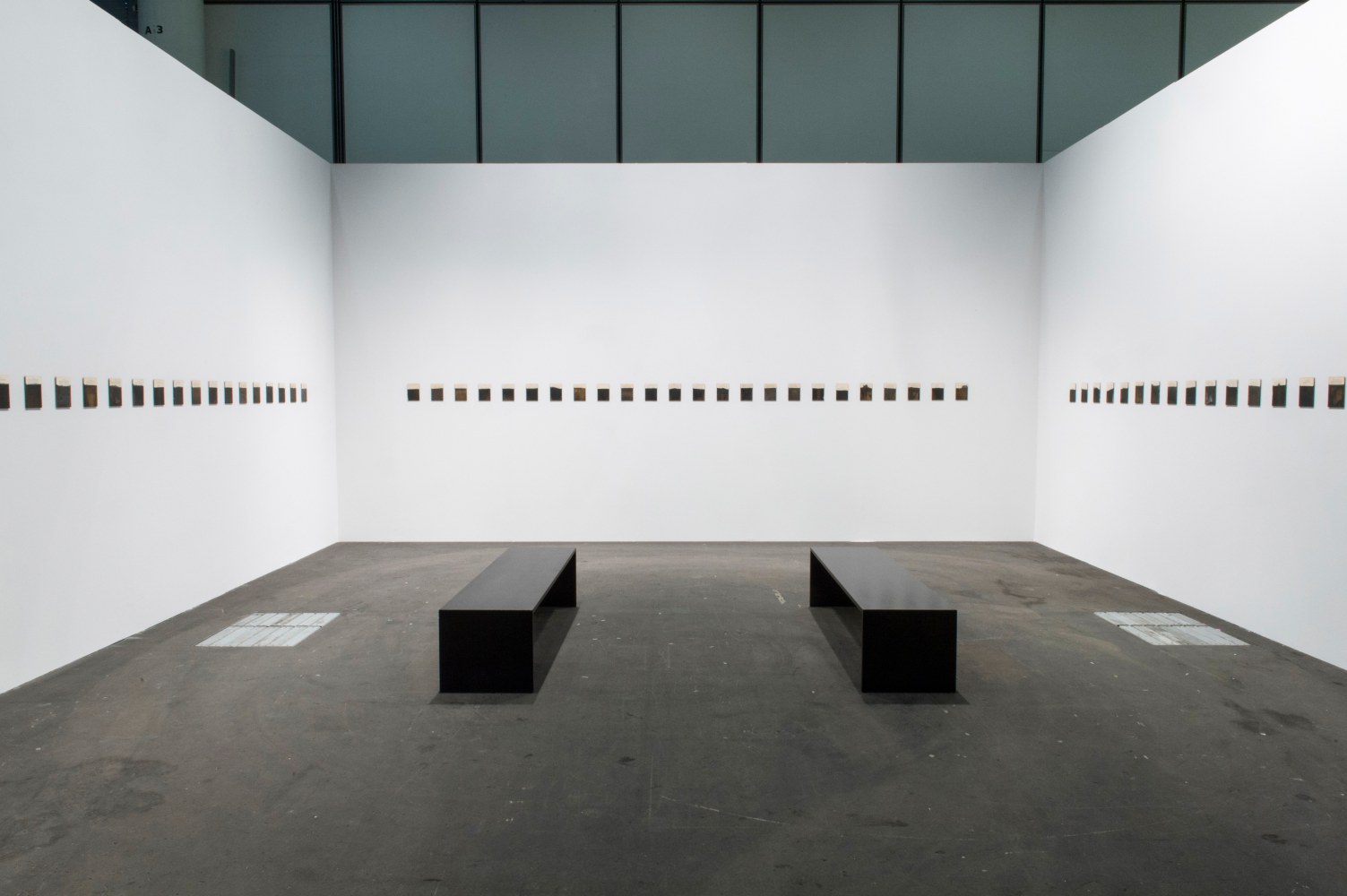 Installation view of paintings by Tim Rollins and K.O.S.