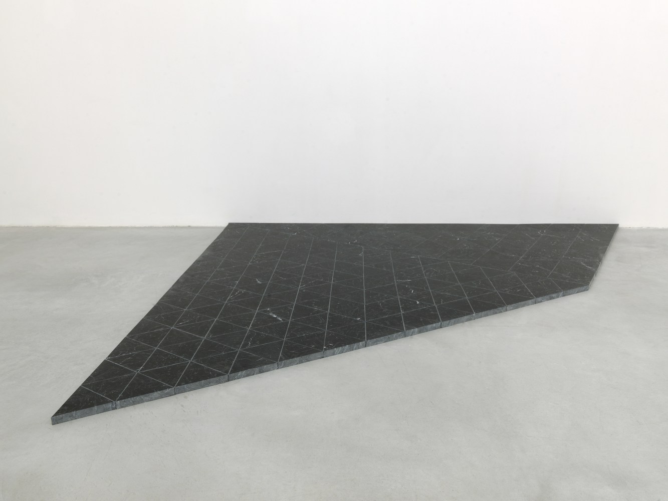 Installation view of sculptures by Oscar Tuazon