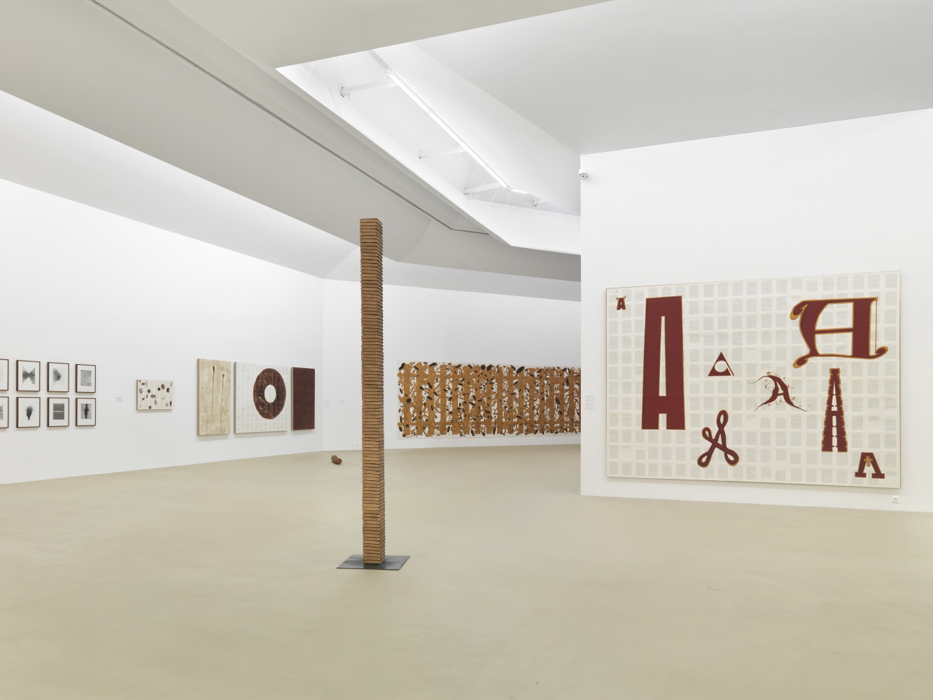 Installation view of paintings by Tim Rollins and K.O.S.