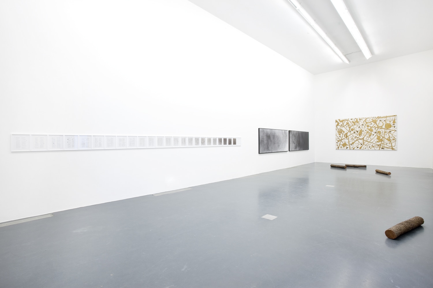 Installation view of paintings by Tim Rollins and K.O.S.