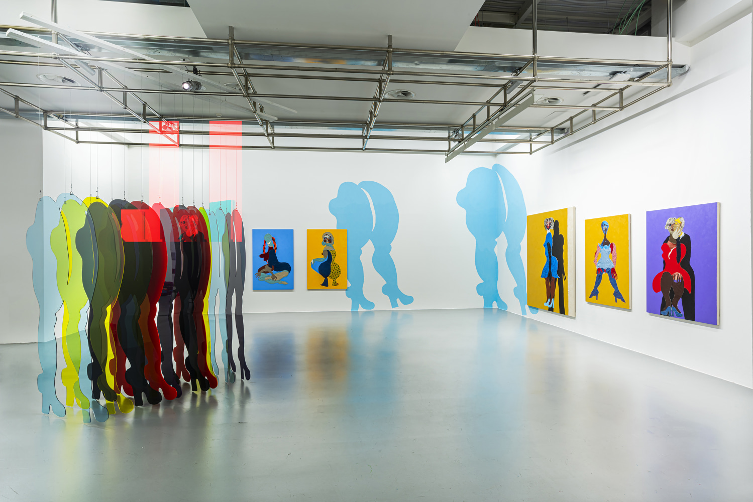 Installation view of paintings and sculptures by Tschabalala Self