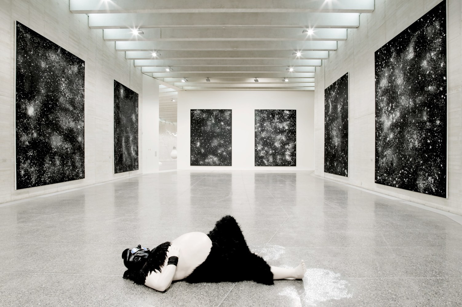 Installation view of sculpture and paintings by Ugo Rondinone