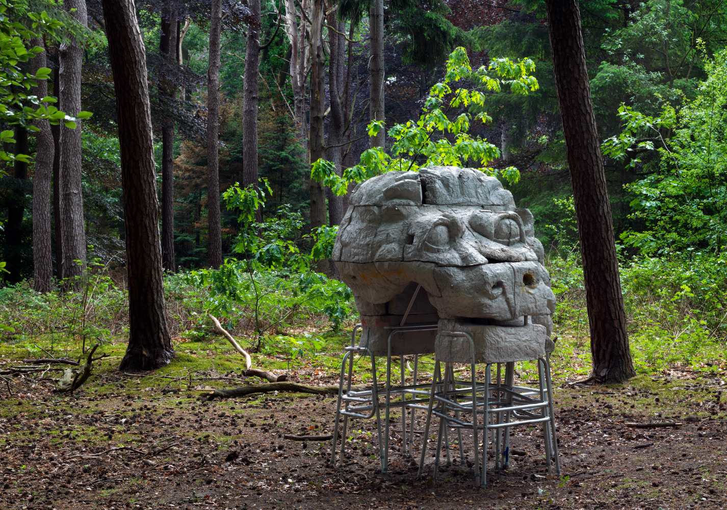 Outdoor view of Justin Matherly sculpture, Cost of Living; mob above, mob below (w.t.n.c.g.l.) 2013 Concrete, ambulatory equipment, spray paint, water-based marker, stainless steel hardware, zip ties 214 x 159 x 152 / 84 1/4 x 62 1/2 x 59 3/4 in