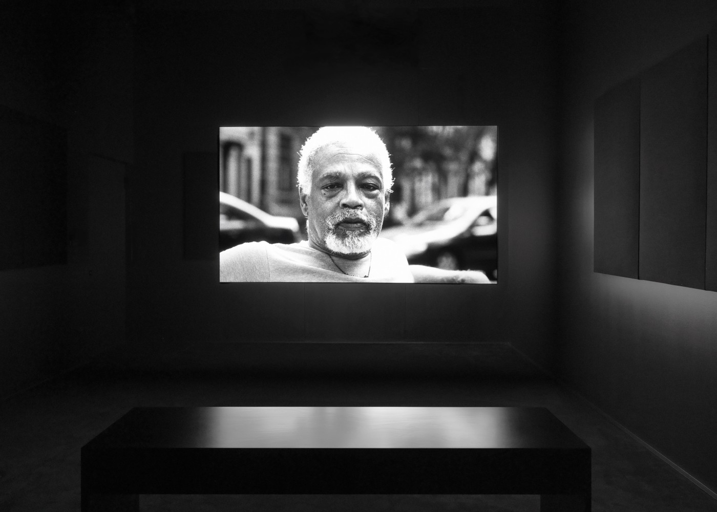 Installation view of Liam Gillick and Adam Pendleton films and wall-based works