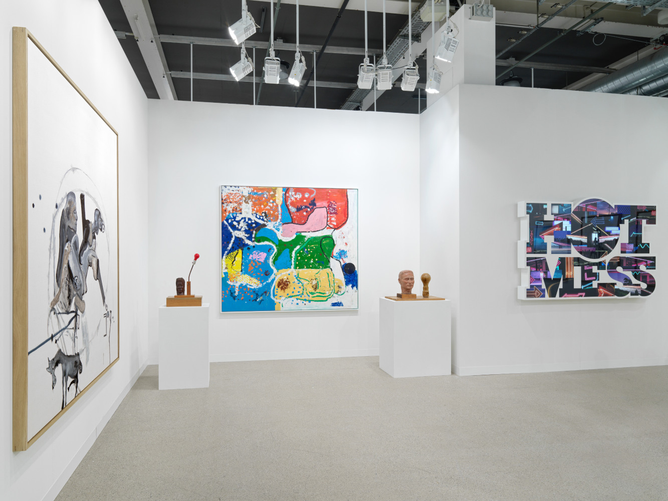 installation view of paintings and sculptures by various artists
