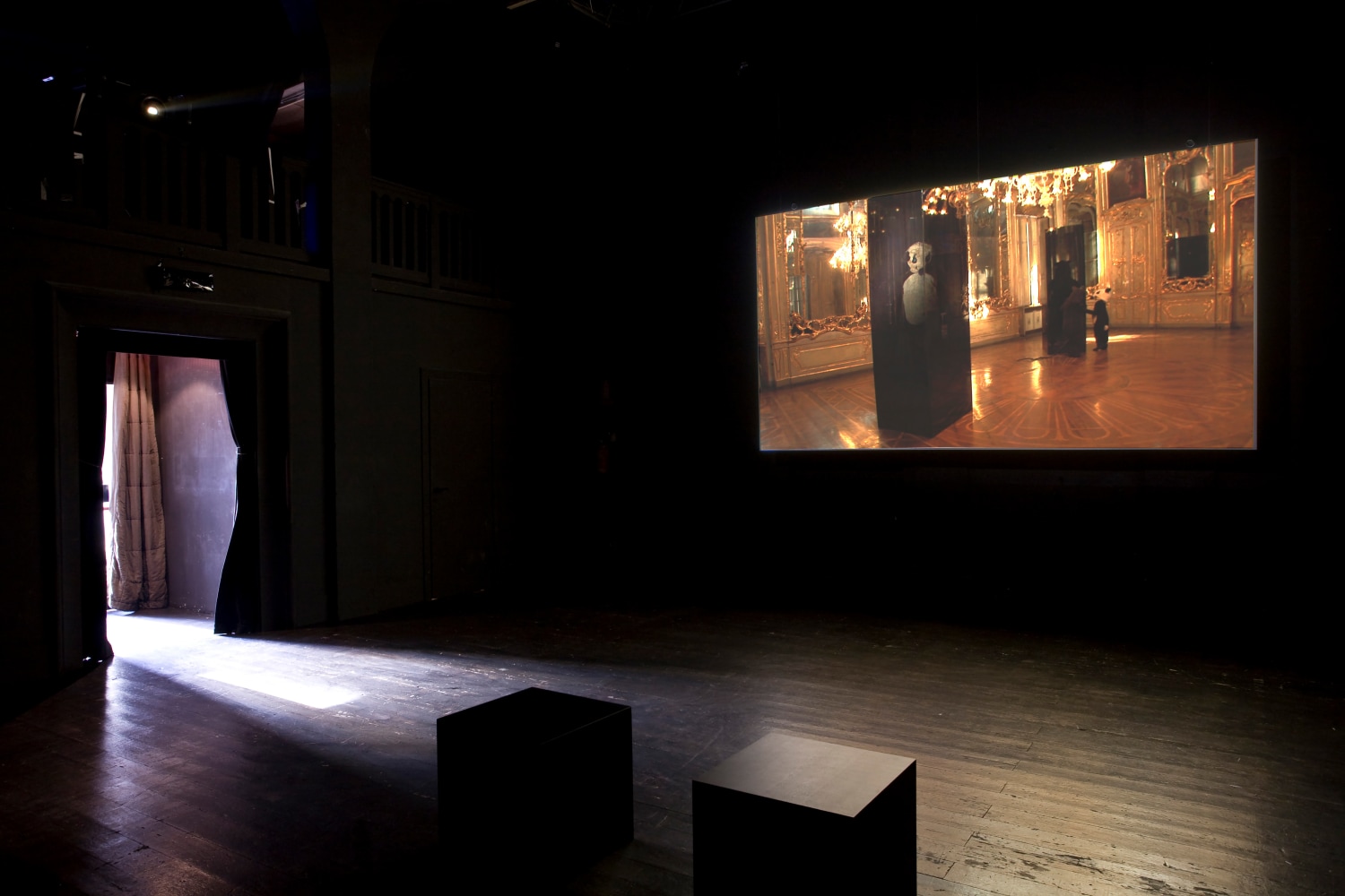 Installation view of video works by Peter Fischli and David Weiss