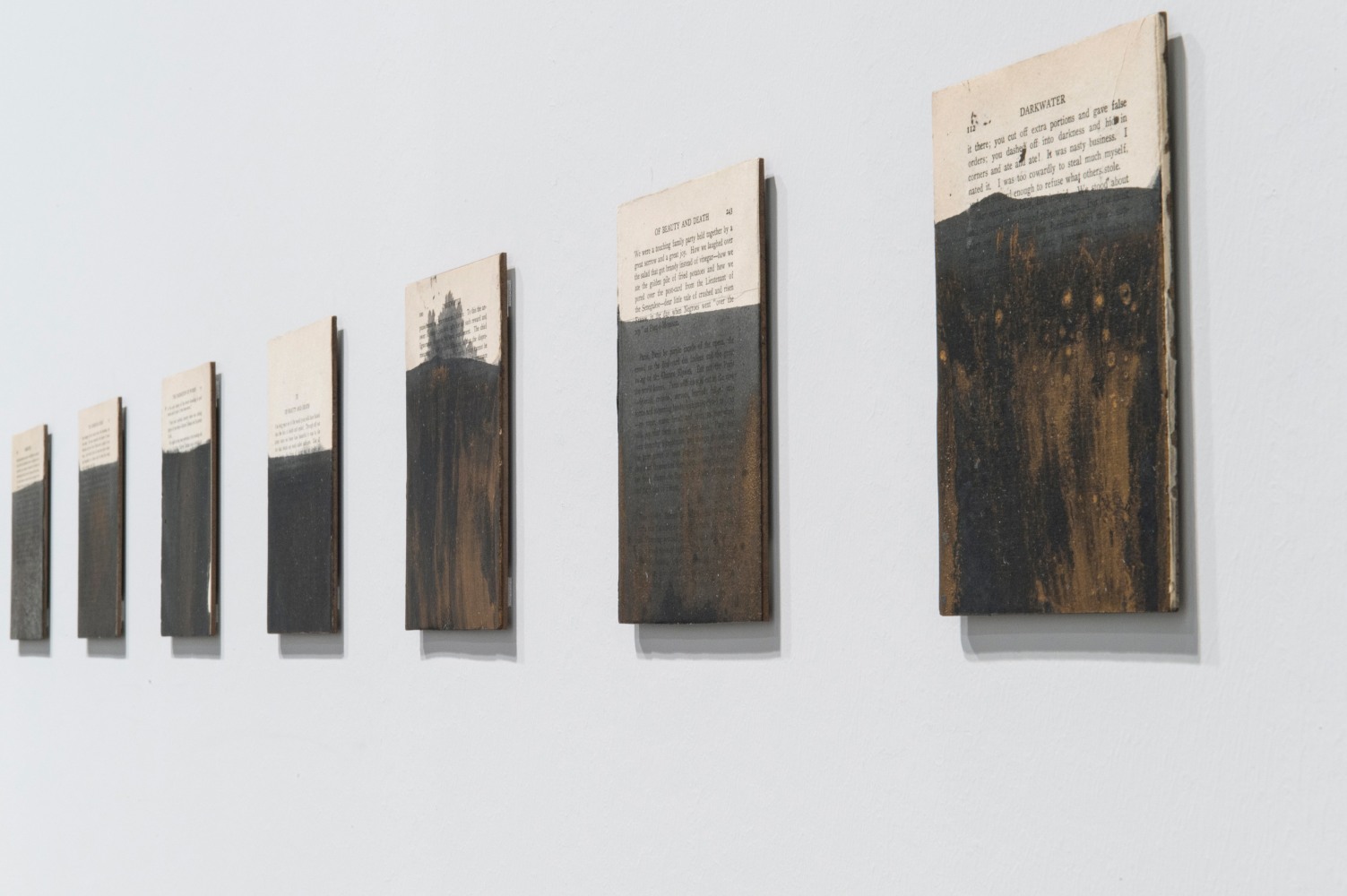 Installation view of paintings by Tim Rollins and K.O.S.