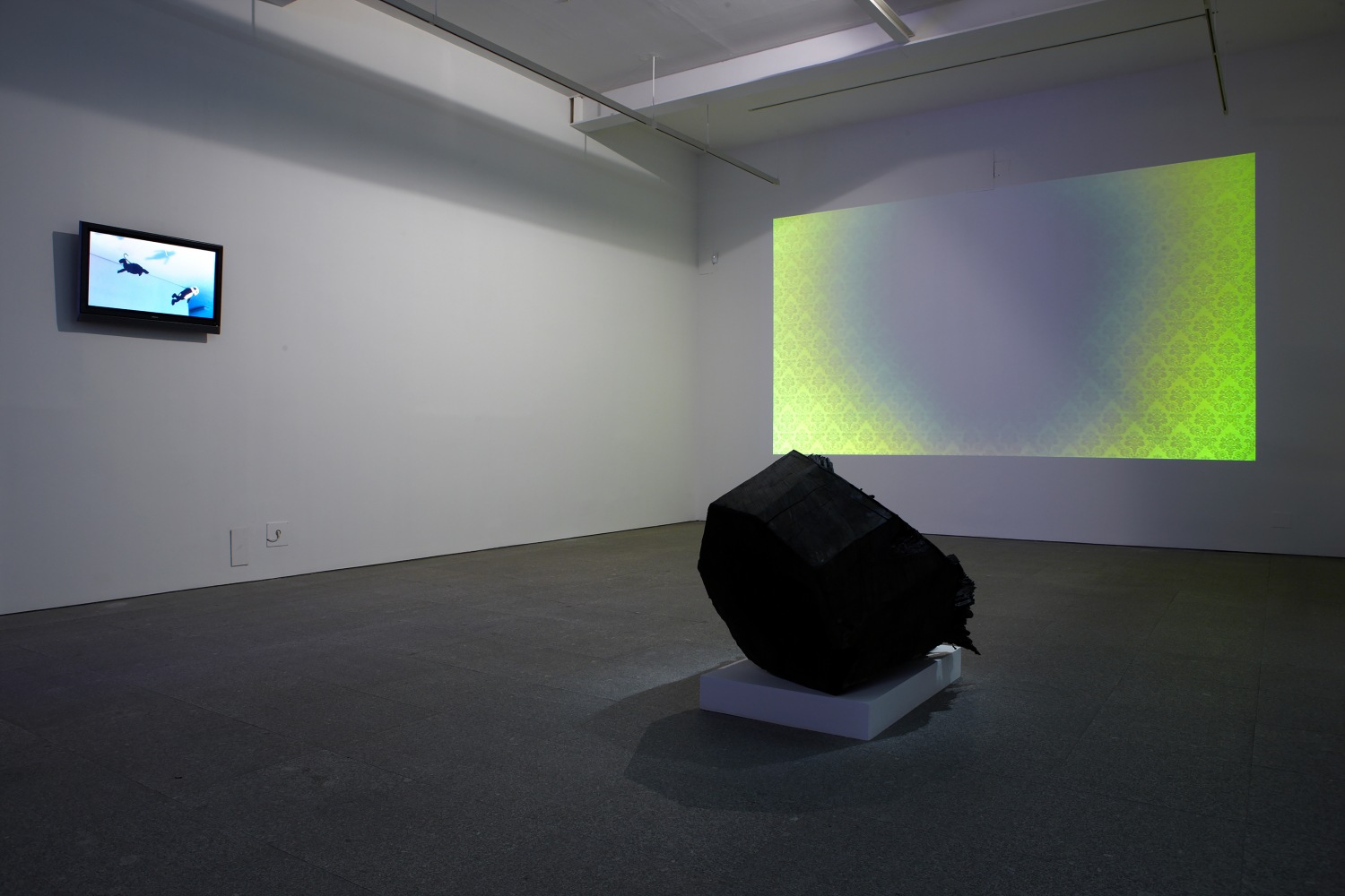 Installation view of sculpture and video works by Peter Fischli and David Weiss