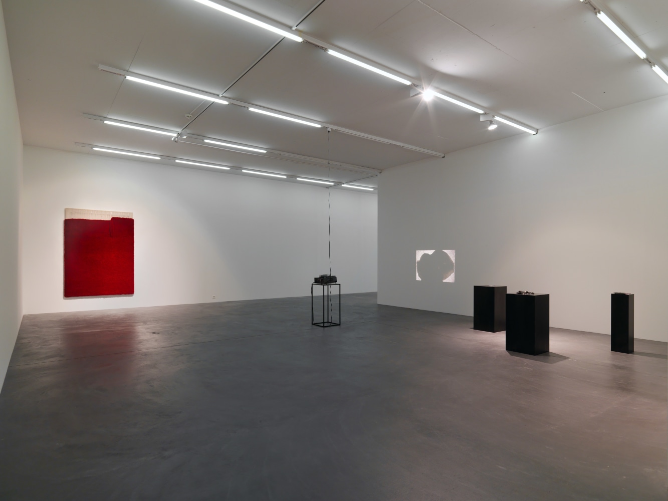 Installation view of paintings, video works and wall works by Latifa Echakhch