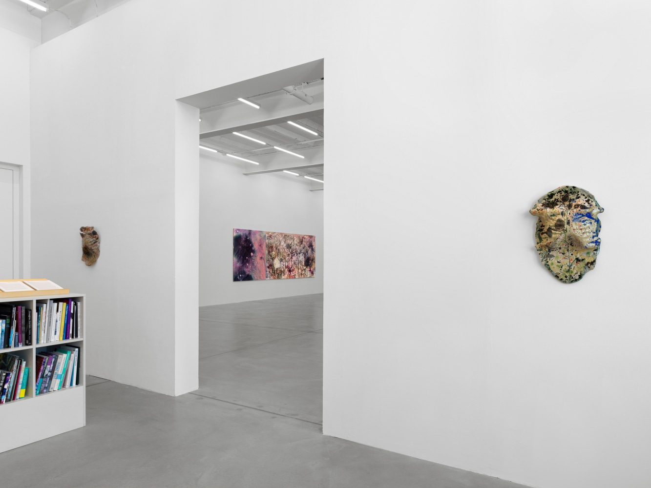 Installation view of Sam Falls paintings and ceramic reliefs exhibition