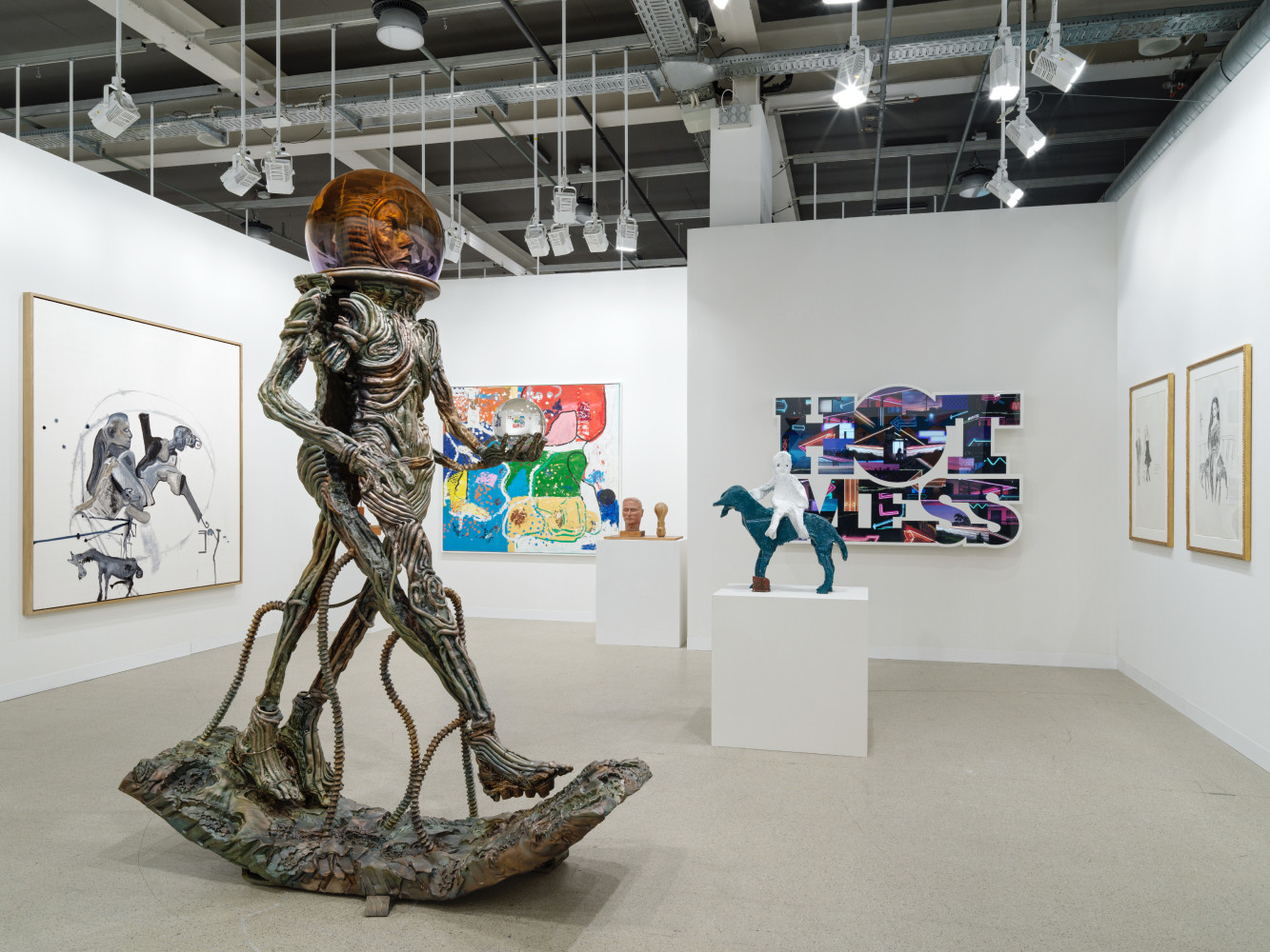 installation view of paintings and sculptures by various artists