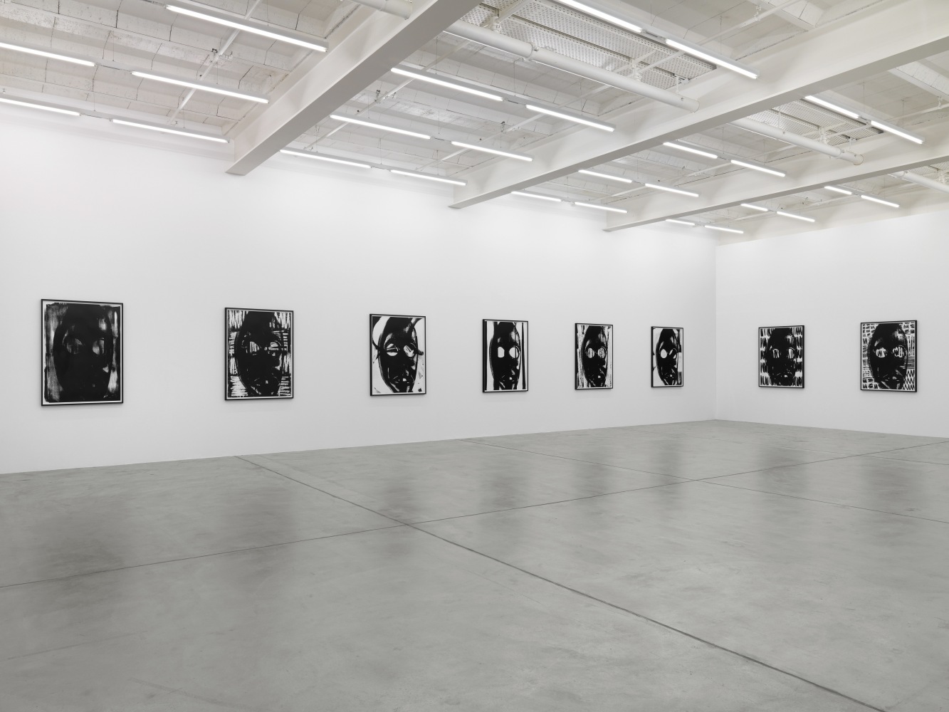 Installation view of Adam Pendleton and Pope.L wall-based works and sculptural installation