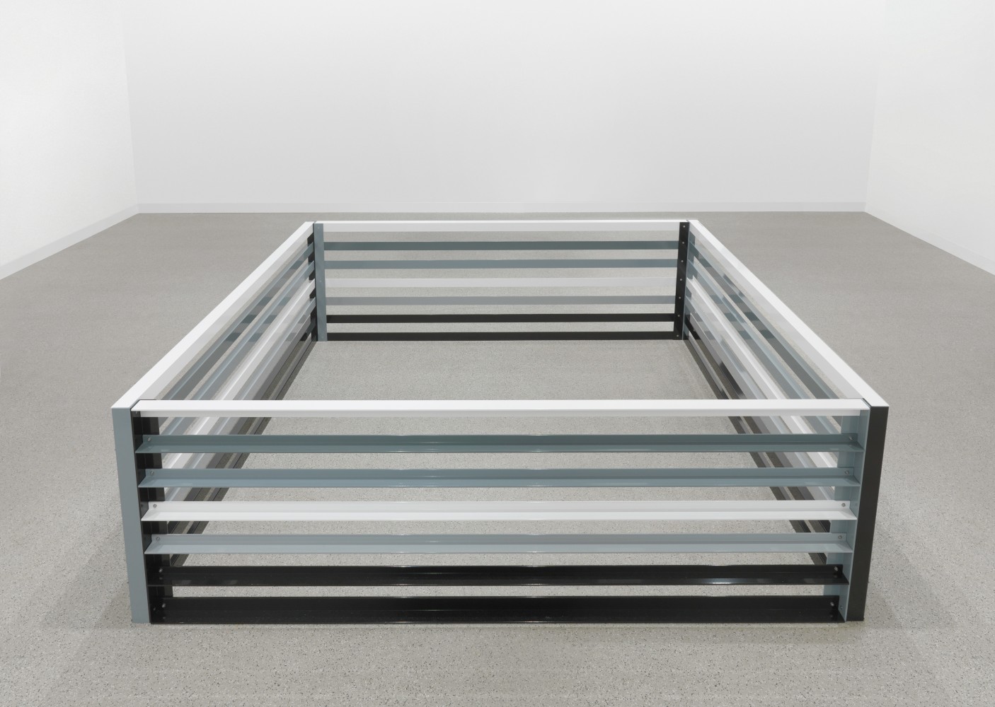 Sculpture by Liam Gillick, Reproofed 2009 Painted aluminum 70 x 201 x 206 cm / 27 1/2 x 79 1/8 x 81 1/8 in