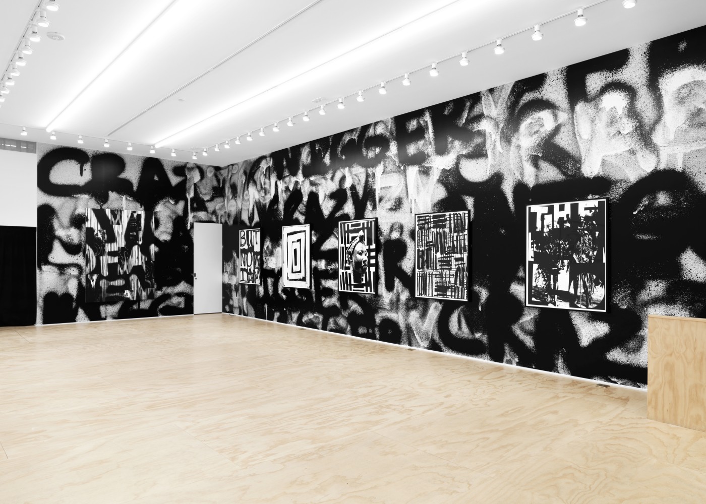 Installation view of Liam Gillick and Adam Pendleton films and wall-based works