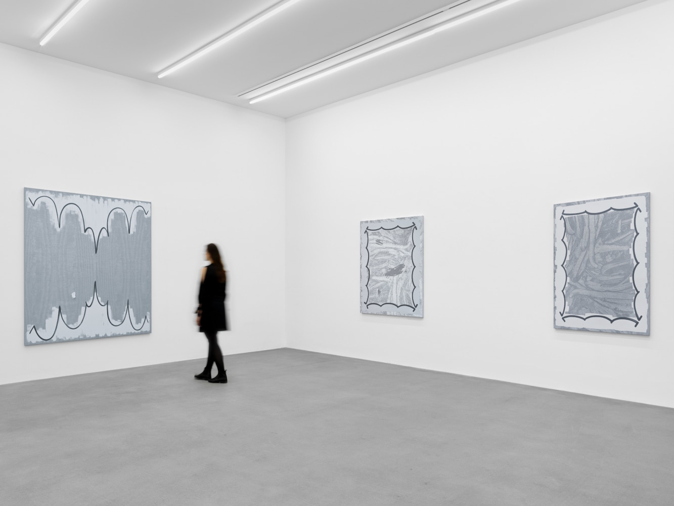 installation view of grayscale paintings by Amy Feldman