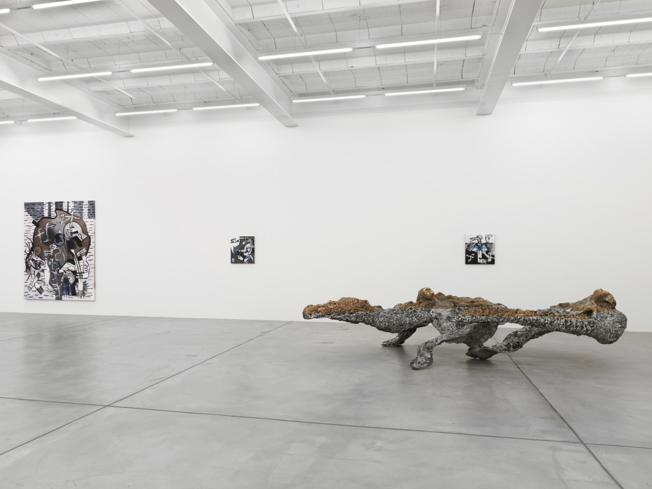 Installation view of group painting, sculpture, and film exhibition