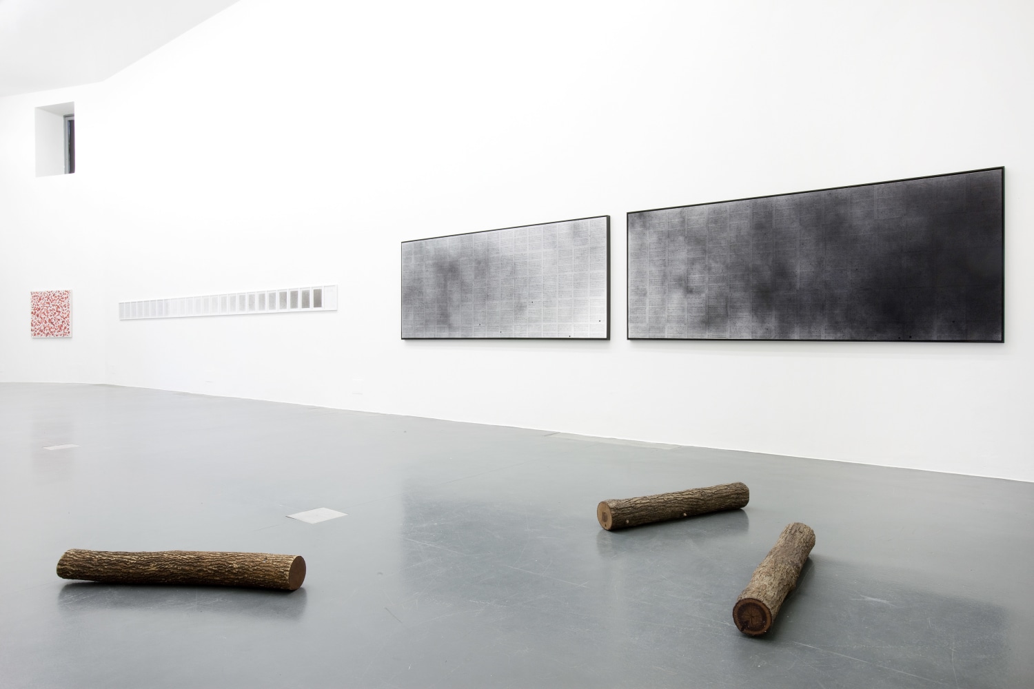 Installation view of paintings by Tim Rollins and K.O.S.