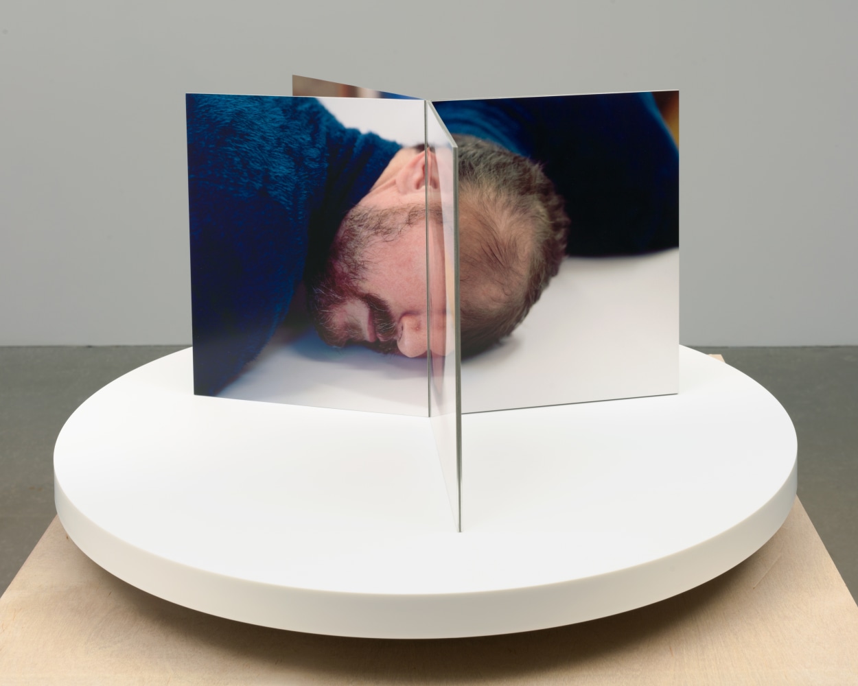Lucas Blalock Film-Object (Artist's Head) 2020 Dye sublimation prints on aluminum, book cloth, motorized turntable display 35 x 59.5 x 59.5 cm / 13 3/4 x 23 3/8 x 23 3/8 in