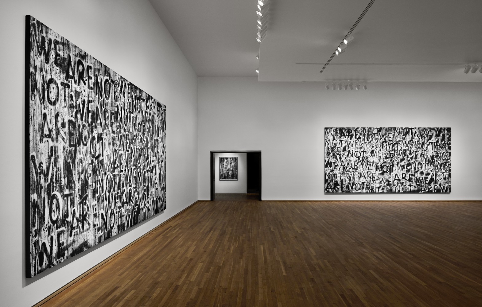 Installation view of black and white paintings by Adam Pendleton