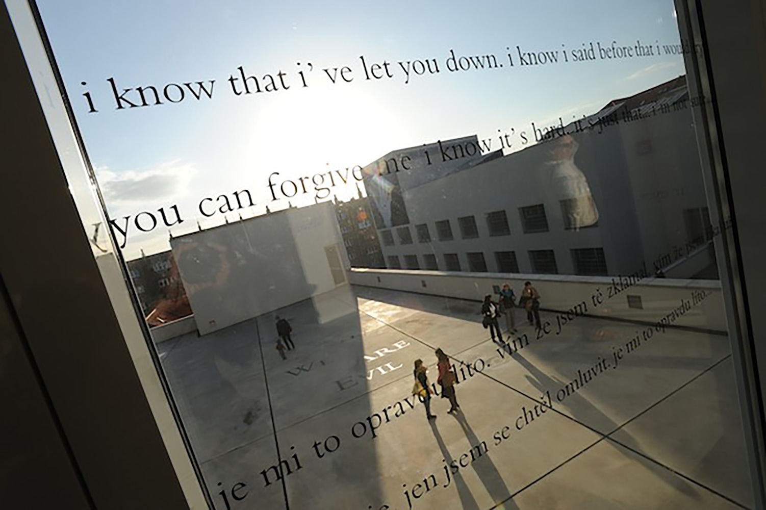Installation view of quotes on a mirror by Douglas Gordon