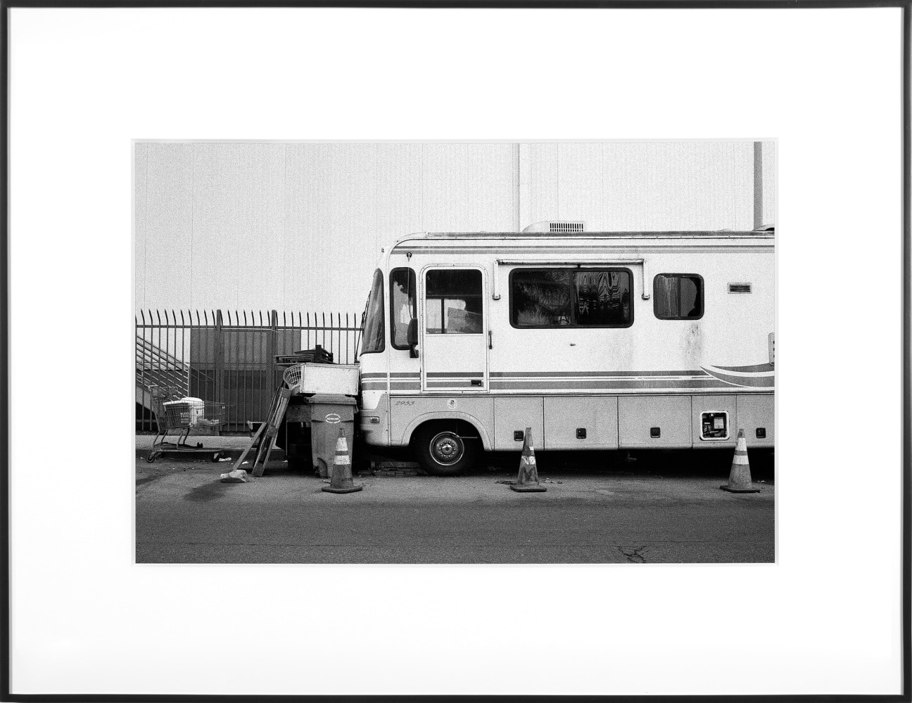 (Temporary) Homes for America: 3300 block to 4400 block, Union Pacific Avenue, between South Grande Vista Avenue and South Marianna Avenue, Los Angeles/Commerce, California, December 2020
2021
Black and white fiber print
Ed. 1/1 + 1 AP
Sheet 20.5 x 30.5 cm / 8 x 12 inches

BESHT48006