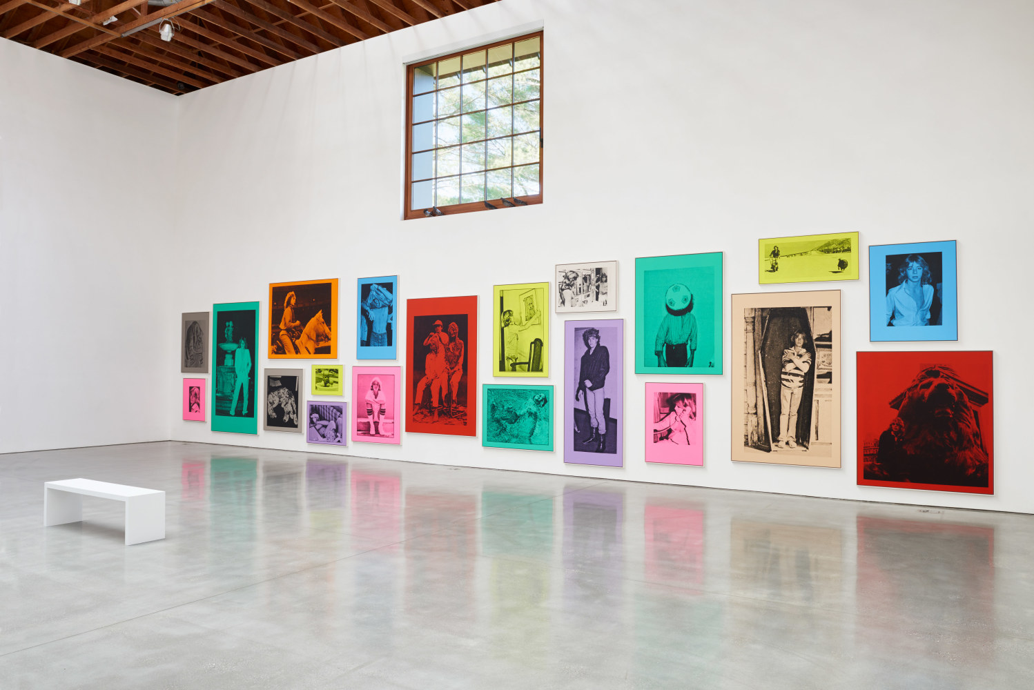 Wall installation of prints by Steven Shearer