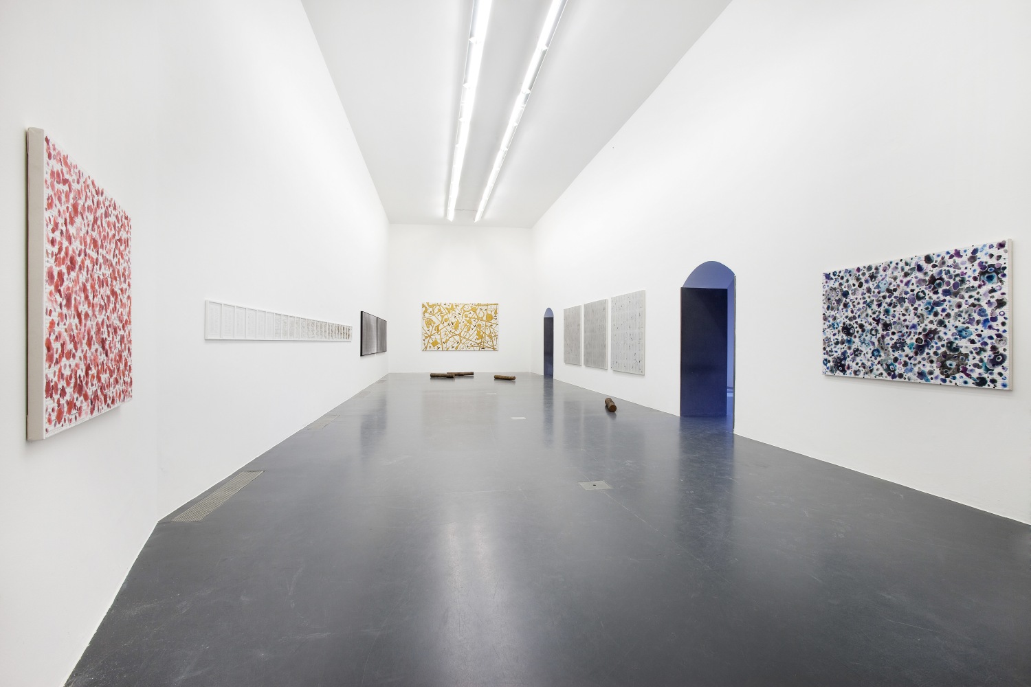 Installation view of paintings by Tim Rollins and K.O.S.