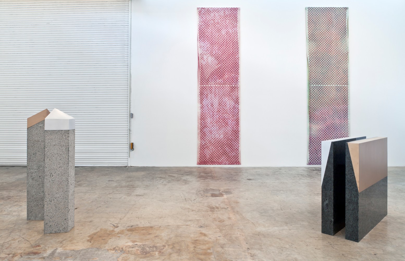 Installation view of paintings and sculptures by Sam Falls