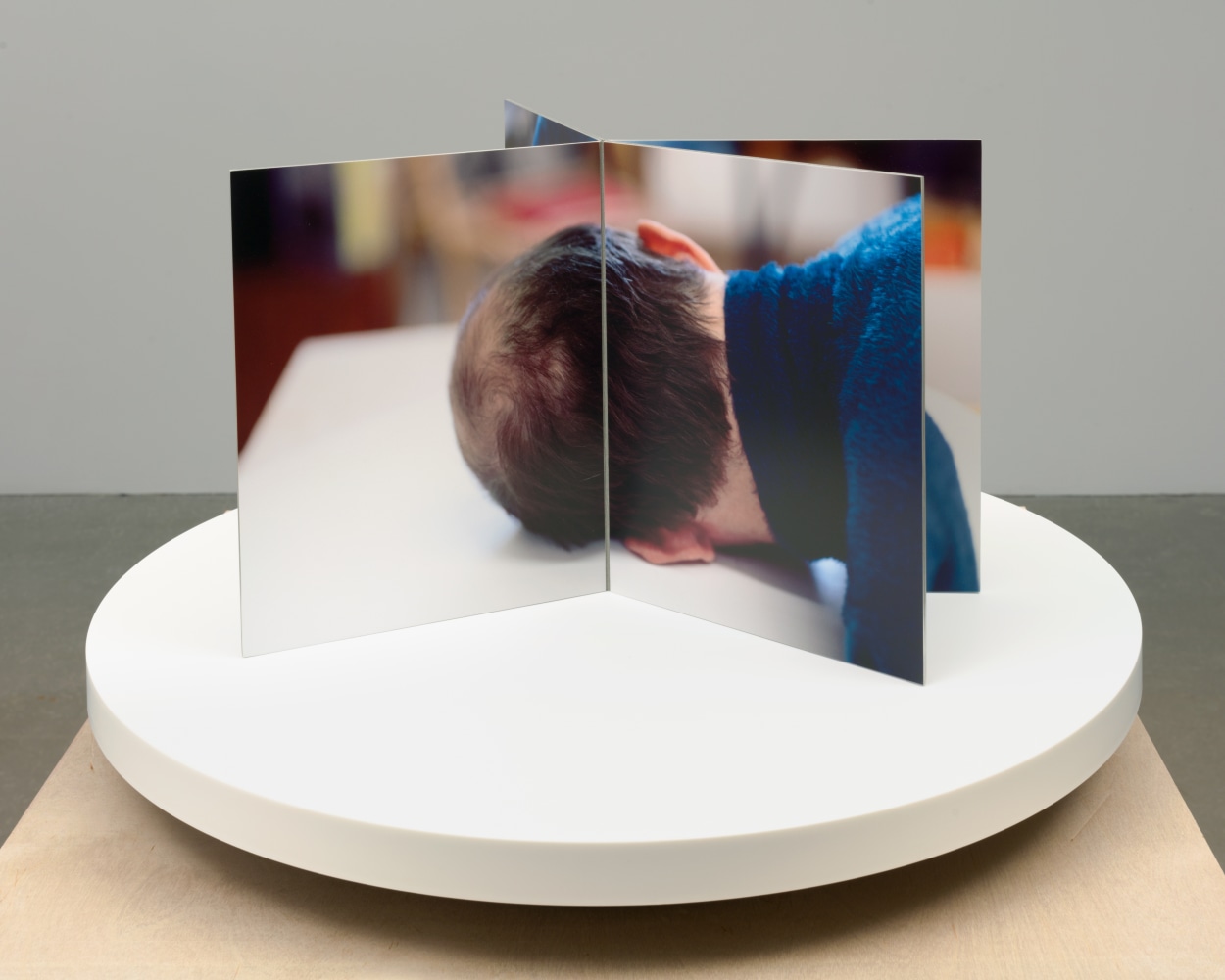 Lucas Blalock Film-Object (Artist's Head) 2020 Dye sublimation prints on aluminum, book cloth, motorized turntable display 35 x 59.5 x 59.5 cm / 13 3/4 x 23 3/8 x 23 3/8 in