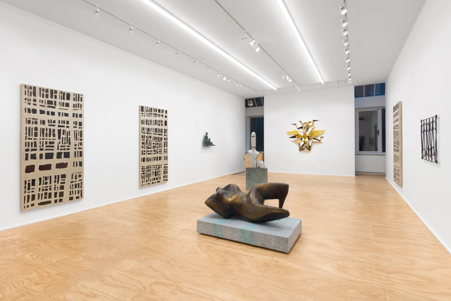 Installation view of sculptures and wall works by Valentin Carron