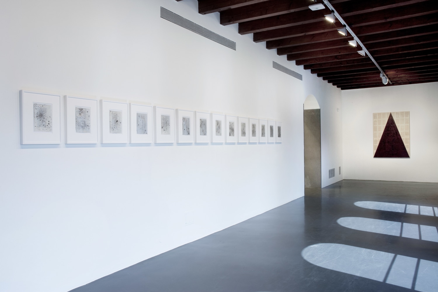 Installation view of paintings by Tim Rollins and K.O.S.