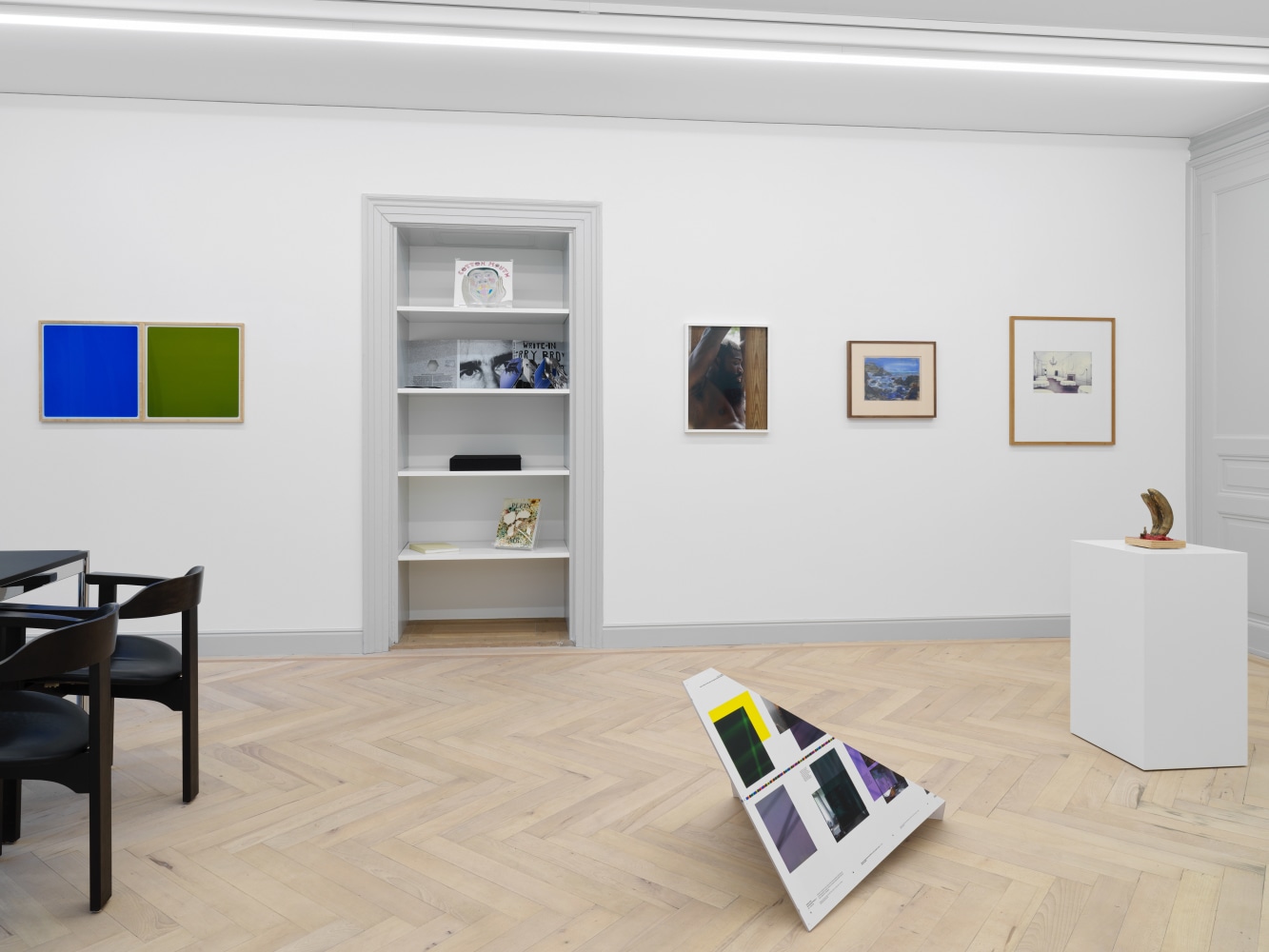 Installation view of group painting, photography, and sculpture exhibition