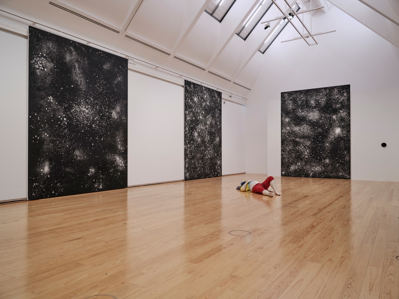 Installation view of paintings and sculptures by Ugo Rondinone